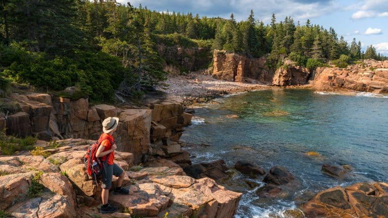 hiker taking in the views in Acadia National Park 1600x900